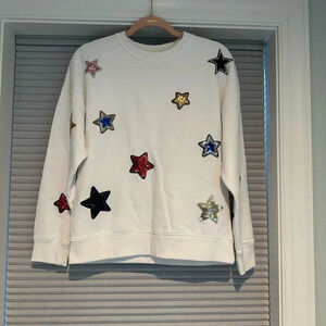 White sweatshirt with sequin appliqué stars